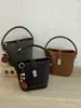 Bolso cubo estilo francés para mujer, nuevo bolso de hombro color-blocking de moda 2026, bolso de mano de nicho para el día a día, bolso pequeño cruzado para damas