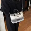 Bolso de mano rayado con bloques de color único para mujer, nueva moda otoñal de tendencia 2026, adecuado para el trabajo y los desplazamientos, bolso de hombro y cruzado