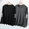 Camiseta de manga larga para hombre, nueva colección primavera/otoño 2026, capa base elástica, top de cuello redondo, versátil y moderno
