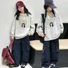 Ropa Infantil Transfronteriza al por Mayor Sudadera para Niñas 2026 Otoño Nuevo Estilo Infantil Holgada Estilo Coreano Top Niños Medianos y Grandes con Capucha Moderna