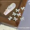 Accesorios para decoración de uñas de lazo de mariposa con circonita, lazo de perla con acabado brillante, accesorios pequeños de diamantes de imitación para uñas portátiles DIY, venta al por mayor