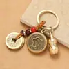 Llavero de latón Wu, dios de la riqueza, transferencia de dinero, cobre puro, cinco emperadores, dios de la riqueza, llave de transferencia, colgante, venta al por mayor, lugar escénico, pequeño regalo