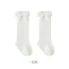 Nuevos calcetines altos para primavera/verano 2026 para bebés niñas, calcetines largos de princesa de malla fina hueca con lazo para niñas