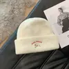 Chapéu de Lã Bordado de Cachorrinho Fofo Feminino Outono Inverno Novo Estilo Emagrecimento Facial Chapéu de Tricô Espesso Quente Chapéu para Cabeça Grande