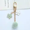 Ins estilo japonés flor de cerezo llavero colgante corazón de chica linda hueco cadena de teléfono funda para auriculares decoración de bolsa