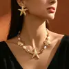 Nuevo collar de estilo bohemio transfronterizo europeo y americano con estrella de mar, grava y coral para mujer, joyería de moda, única, creativa y exagerada
