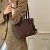 Elegante bolsa feminina vintage 2026 nova outono versátil casual bolsa de ombro versão coreana bolsa tote para o dia a dia