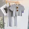 Ropa infantil coreana para niñas 2023 Verano conjunto de estilo extranjero camiseta de manga corta coreana para niños top + pantalones acampanados conjunto de dos piezas
