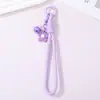 Novo cordão de celular de flor de borracha com flores pequenas tridimensionais e sinos, acessório DIY para mochilas e chaveiros, pingente decorativo versátil