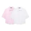 Venta al por mayor transfronteriza 2026 moda europea y americana casual simple camisa de manga corta para mujer con decoración de botón de perla artificial D25450