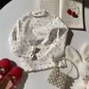 Roupa de outono gola semi-alta roupas infantis para meninas estilo coreano top novo estilo outono 2026 camiseta base infantil com barra babada camiseta floral