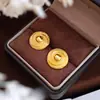 Pendientes circulares de tejido cruzado versátiles europeos y americanos, acero inoxidable chapado en oro de 18 quilates, de moda, lujo ligero, pendientes personalizados al por mayor