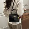 Bolso de Mano de Color Sólido Simple y Elegante 2026 Primavera Nuevo Casual Chic Hombro Cruzado Pequeño Cuadrado para Mujer