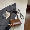 Bolso Cubo Tejido de Patrón de Nicho Francés para Mujer 2026 Nuevo Moderno Elegante Bolso de Hombro Único Versátil Bolso Cruzado Simple