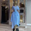 Roupas femininas transfronteiriças europeias e americanas 2026 verão novo estilo elegante casual gola redonda listrado top e saia irregular conjunto