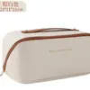 Bolsa de maquillaje portátil con forma de almohada más vendida transfronteriza, patrón de cuadros de piel sintética, bolsa de almacenamiento de mano, neceser de viaje de gran capacidad