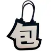 Nuevo bolso de fieltro creativo para salir, bolso tote de fieltro de gran capacidad, bolso de fieltro versátil de nicho abstracto
