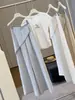 Pantalones anchos irregulares de algodón y lino de seda helada para mujer, pantalones rectos fluidos de tono gris de alta gama para verano, pantalones casuales con un look sofisticado para ir al trabajo