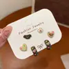 Pendientes de cachorro lindos amor pendientes mujer otoño e invierno nuevos pendientes de traje de dibujos animados pendientes de diseño pequeño exquisito