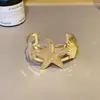 Anel de Braço de Flor de Metal Exagerado Transfronteiriço Europeu e Americano Pulseira de Borboleta Dourada para Mulheres Doce Cool Spice Girl Pulseira de Braço com Linha de Sentido Avançado