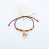 Pulseiras de Natal artesanais mais vendidas na Amazon em vendas transfronteiriças, apresentando designs de Papai Noel e árvore de Natal, com cordões vermelhos e verdes e um efeito que brilha no escuro