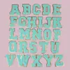 Atacado Patches de Letras Inglesas Verdes com Borda Dourada, Acessórios para Roupas, Bordado em Toalhas, Patches de Tecido Bordados, Emblemas Bordados, Patchwork