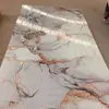 Producción de Paneles UV de Alto Brillo tipo Mármol Imitación, Paneles para Pared de Fondo, Paneles de Pared Jazz White con Patrón Continuo, Resistentes al Agua y al Fuego, Personalización Resistente al Fuego