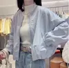 Chaqueta Corta Sencilla de Cuello Redondo Color Sólido Estilo Coreano para Mujer 2026 Primavera Nueva Casual Holgada Versátil Petite Chaqueta de Moda
