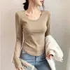 Camiseta de algodão canelado de manga comprida para mulheres, novo estilo primavera e outono, versátil, com barra irregular curva, camiseta base slim fit para mulheres