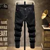 Jeans Preto Puro Primavera 2025 Marca da Moda Masculina Slim Fit Perna Afunilada Verão Estilo Coreano Calças Casuais Jovens Masculinas Atacado