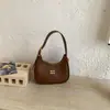 Bolso de axila moderno y único estilo coreano, bolso de mano de moda estilo ins, bolso tipo dumpling para el trabajo y los desplazamientos, bolso de hombro y cruzado de moda