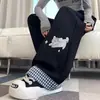 Nova coleção de primavera e outono: calças casuais estilosas e elegantes de retalhos xadrez para meninas, com um design de gato doce e fofo e corte reto