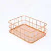 Caja de almacenamiento de escritorio al por mayor Cesta de almacenamiento de hierro Cesta de almacenamiento de acabado Oro rosa Cesta de almacenamiento hueca para el hogar