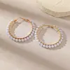 Venta al por mayor de pendientes grandes de aro estilo coreano con perlas y cristales, un accesorio moderno y lujoso para mujer, con un diseño único y vintage
