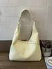 Bolsa Tote Personalizada com Rebites Cor Sólida de Grande Capacidade Design de Nicho para Mulheres 2026 Primavera Novo Estilo Bolsa de Ombro Único