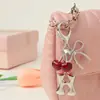 Llavero de 26 Letras de Comercio Exterior Europeo y Americano, Nuevo Encanto para Bolso con Colgante de Cereza y Lazo Estilo Dulce Ins para Mujeres