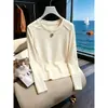 Elegante camiseta de manga larga ajustada para mujer, nuevo modelo otoño 2026, simple y chic, versátil, color albaricoque, top de algodón puro