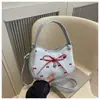 Bolso bandolera minimalista de estilo coreano para mujer, bolso de hombro, nuevo bolso de mano de moda dulce con lazo, de almacenamiento casual