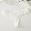 Calcinhas de renda sexy europeias e americanas para mulheres, fio dental romântico de malha com laço, fio dental feminino transparente sedutor de cintura baixa