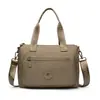 2026 de alta gama, moda nicho, bolso de hombro versátil, color sólido, bolso tote simple, bolso de mano de moda versátil