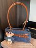 Bolsa de Braço para Mulheres 2025 Novo Estilo High-End Fashionável Feminina Verão Versátil Design de Nicho Bolsa de Ombro Único Bolsa Baguete