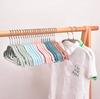 Percha creativa para ropa de niños color sólido plástico por inmersión percha sin costuras percha de almacenamiento para tienda de ropa percha para puesto venta al por mayor