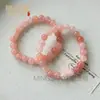 Venta al por mayor del fabricante Pulsera de Flor de Durazno Original de Xinjiang Natural Jade Oro Seda Jade Flor de Durazno Relleno Polvo de Cristal Rosa