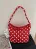 Bolso cruzado de nailon con lunares de nicho para mujer 2025 Nuevo bolso versátil de hombro y axila para salir y trabajar Bolso de mano pequeño