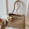2026 Design de Nicho Bolsa Kelly Bolsa de Trabalho de Alto Padrão para Mulheres Bolsa de Ombro Simples Nova Bolsa Transversal Pequena Bolsa de Mão