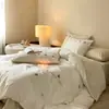 Juego de cuatro piezas de algodón de fibra larga 100S, bordado cepillado, funda de cama de algodón puro engrosado para otoño e invierno, estilo sábana ajustable