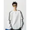 Camiseta de manga larga con bloques de color a rayas negras, top base casual de estilo americano moderno de corte holgado para hombre, sudadera