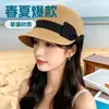 Gorra de béisbol popular de paja negra con lazo para primavera y verano para mujer, adecuada para la playa, vacaciones junto al mar, actividades ecuestres y protección solar
