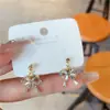 Pendientes coreanos de nuevo estilo con lazo para mujer, Pendientes de botón de circón y perla de nicho de lujo ligero de moda