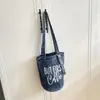 Bolso de Mezclilla Casual Estampado Estilo Coreano 2026 Primavera Nuevo Simple con Letras Personalizado Cubo Hombro Cruzado